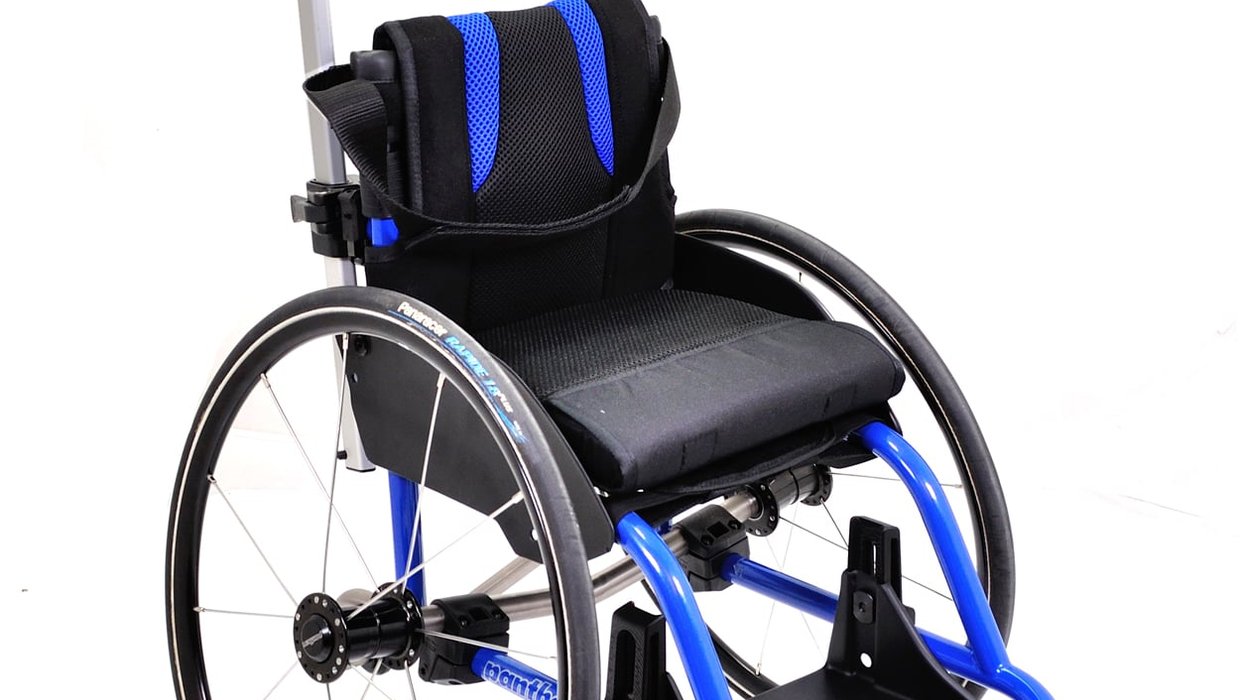 A blue and black Panthera Micro wheelchair for under 5s