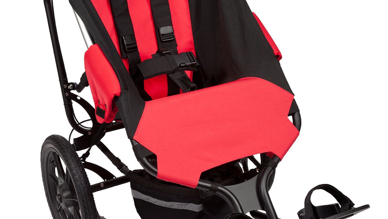 A red and black Delichon Delta special needs buggy