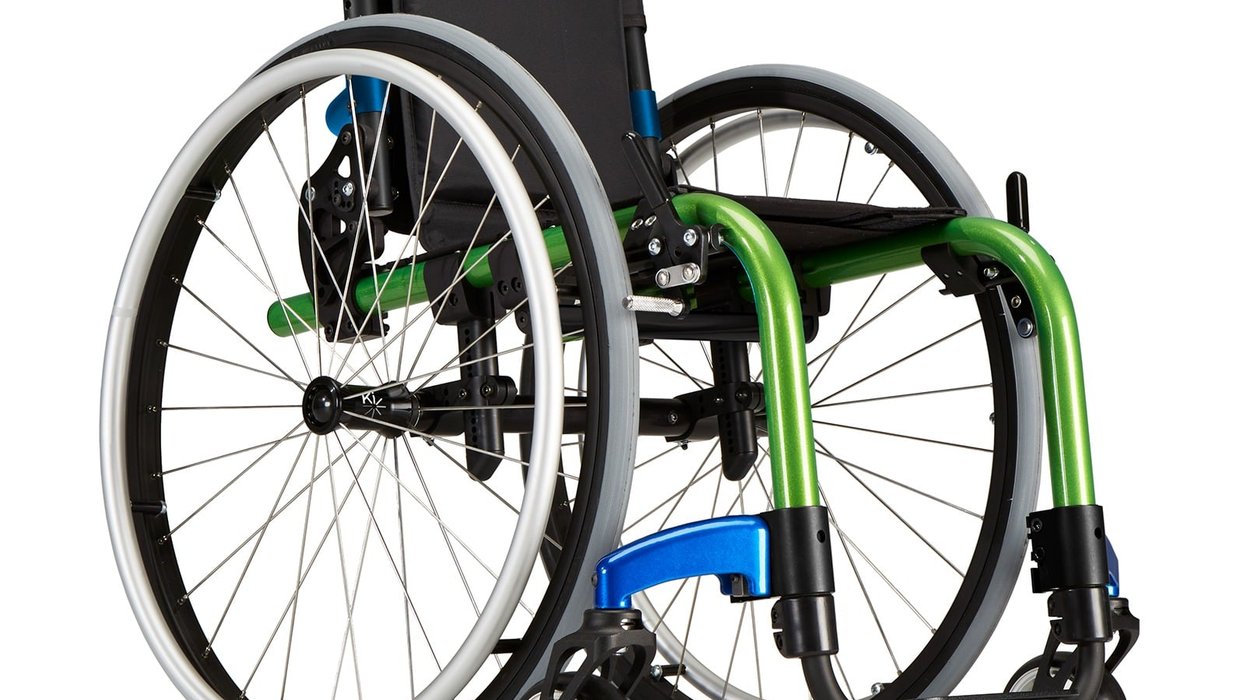 A green and black Little Wave Clik manual wheelchair