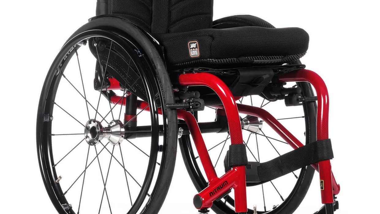A black and red Nirtum manual wheelchair