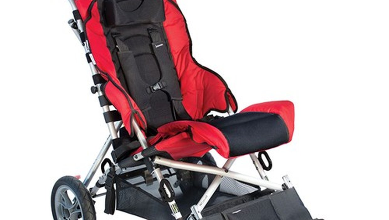 A red and black Convaid Cruiser special needs buggy