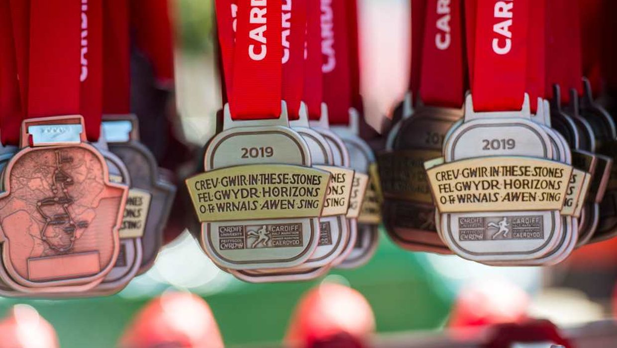 Medals from the Cardiff Marathon hang down on display